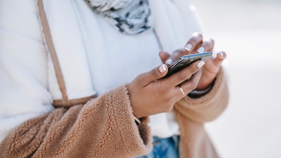 woman scrolling through phone